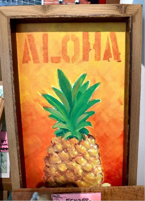Aloha Pineapple Artwork Sign at the Ukulele Store in the Waikiki Beach Walk Shopping Plaza.