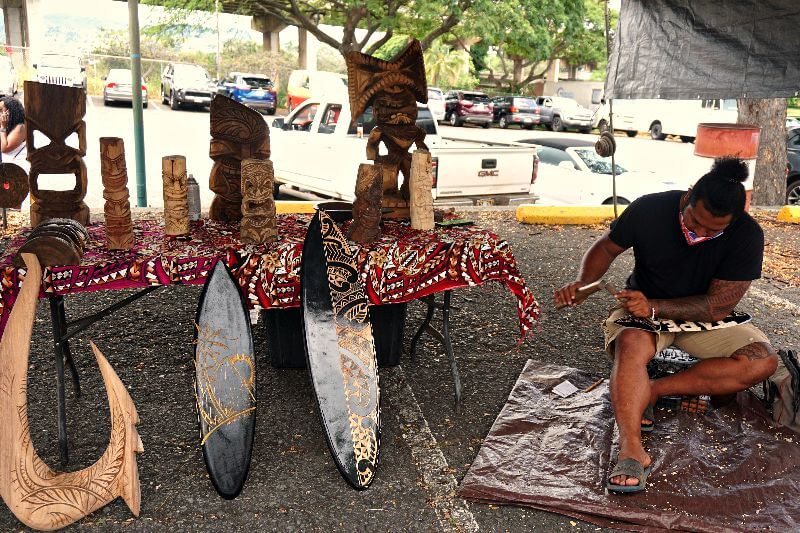At the Aloha Stadium Swap Meet, you can find a talented wood carver showcasing their craftsmanship, offering intricately carved wooden sculptures and traditional Hawaiian art pieces.