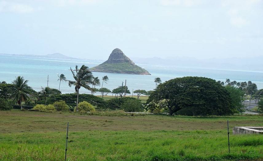 Chinaman's Hat is a small, cone-shaped island off the coast of Oahu, Hawaii, resembling a traditional Asian hat and providing a picturesque backdrop for outdoor activities and scenic views.