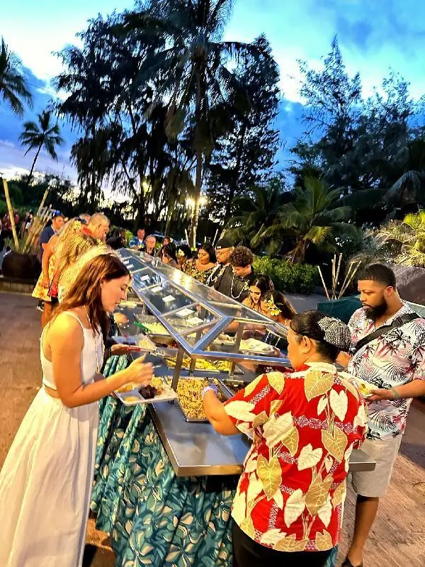 The Germaine's Luau Buffet Spread offers a delicious and diverse selection of Hawaiian and Polynesian cuisine for guests to enjoy at Germaine's Luau in Kapolei, Hawaii.
