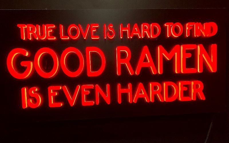 The Good Ramen Sign is a vibrant and eye-catching sign that signifies a delicious and satisfying bowl of ramen awaits inside, inviting ramen lovers to indulge in a flavorful culinary experience.
