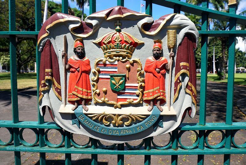 The Iolani Palace emblem is a regal and intricate design featuring the royal crest of the Hawaiian monarchy, representing the sovereignty and heritage of Hawaii's past.