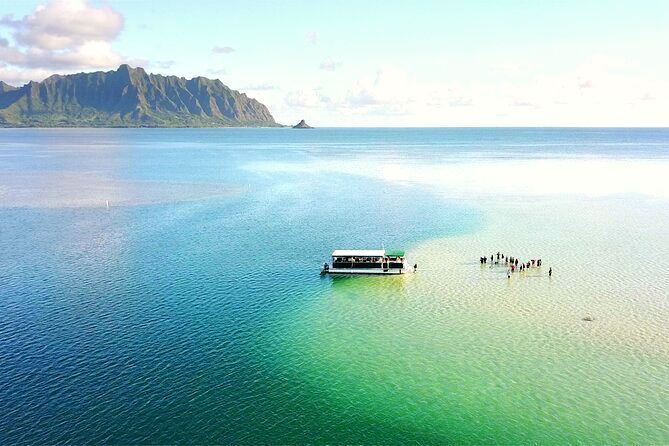The Kaneohe Sand Bar Tour offers a unique and unforgettable experience, taking visitors on a boat excursion to a stunning sandbar in Kaneohe Bay, where they can relax, swim, and enjoy the breathtaking views of the surrounding mountains and turquoise waters. ⛵🏝️
