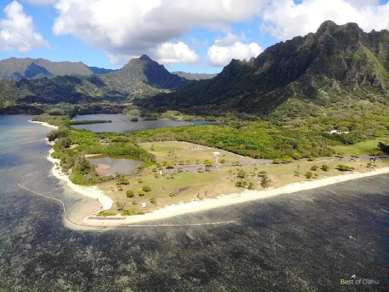 Kualoa Beach Park, with its stunning surroundings and Mokoli'i Island, also known as Chinaman's Hat, is captured beautifully in aerial drone photos, showcasing the natural beauty of the area.