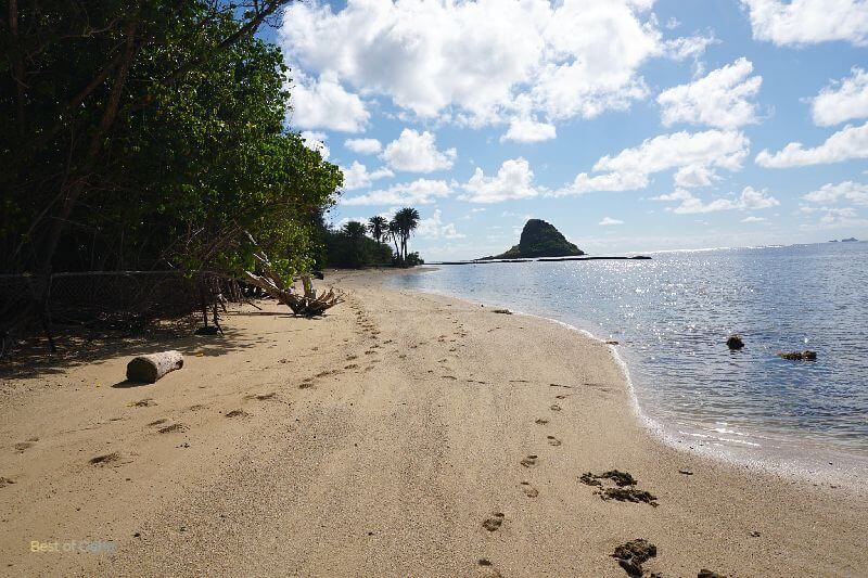 The Kualoa Regional Park offers a stunning view of Chinaman's Hat, a distinct offshore island, providing a picturesque backdrop of natural beauty for visitors to enjoy on Oahu, Hawaii.