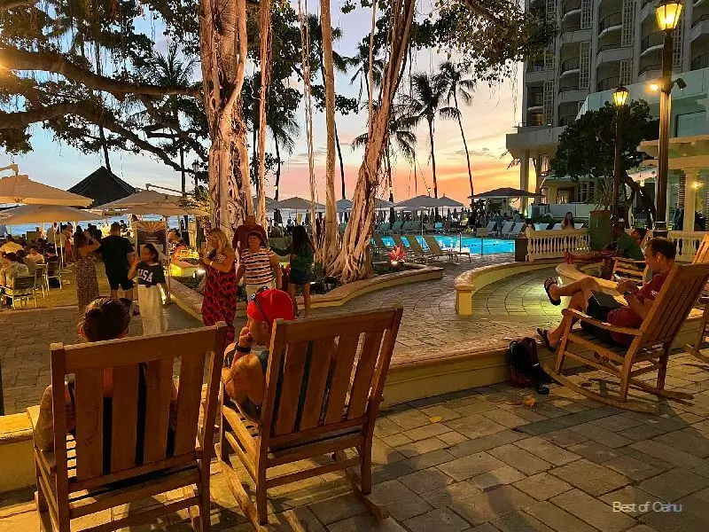 The Moana Surfrider Courtyard & Pool is a tranquil oasis surrounded by lush greenery and palm trees, offering a serene and inviting space for guests to relax and enjoy the Hawaiian sunshine. 🌴☀️