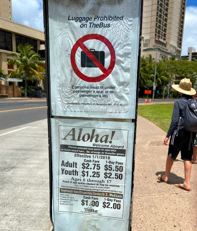 The Oahu Bus has specific guidelines for luggage, and while there is no specific luggage sign, passengers are generally allowed to bring carry-on size luggage on board, either holding it on their lap or placing it in the designated luggage area if available. 🚍🧳