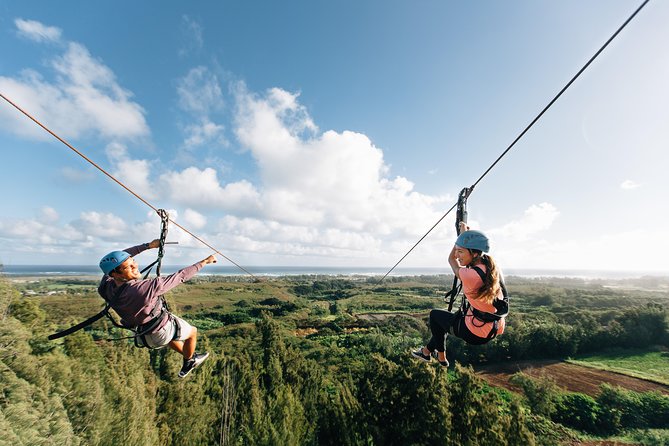 The Oahu North Shore Zipline provides an exhilarating adventure, allowing participants to soar through the lush tropical landscape and enjoy breathtaking aerial views of the island's natural beauty.