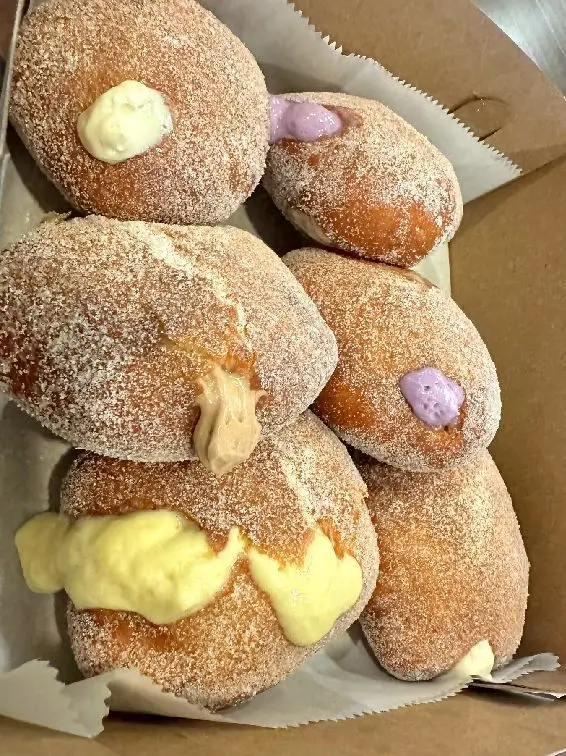 Pennys Malasadas that is located in the Royal Hawaiian Shopping Center Food Court.