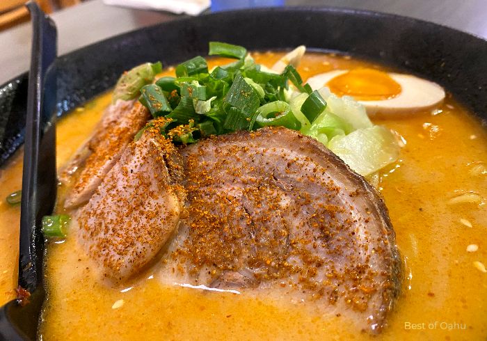 Rai Rai Ramen Tan Tan Bowl is a flavorful and spicy ramen dish that combines a rich and creamy broth with a bold blend of sesame, chili oil, and ground pork, creating a tantalizing and satisfying culinary experience.