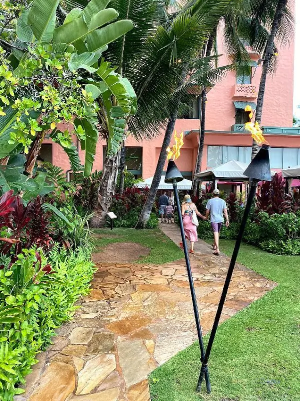 Royal Hawaiian Hotel tiki torches on the side of the hotel.
