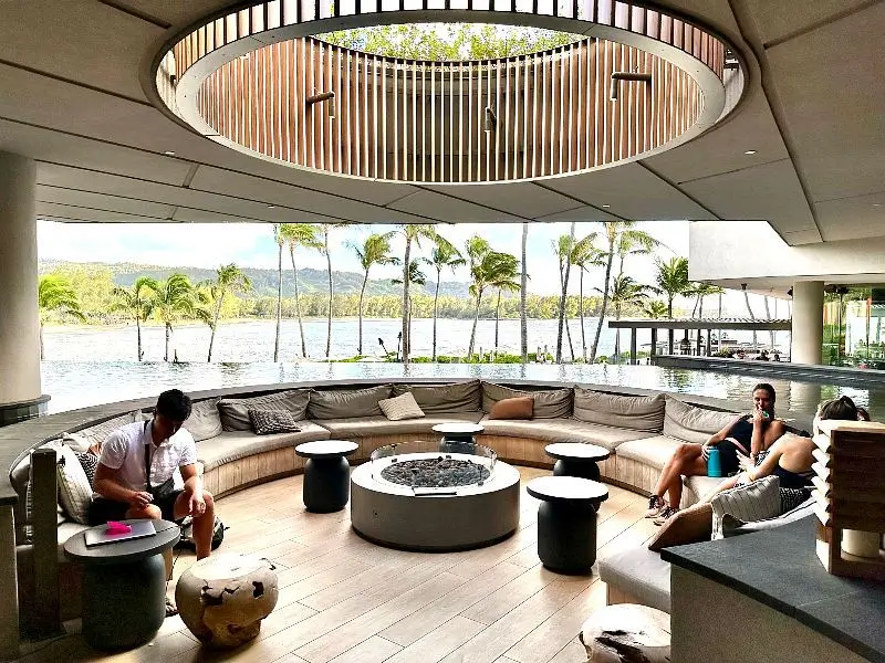 Turtle Bay Resort lobby sitting area Turtle Bay Resort lobby sitting area, with an open air view of palm trees and the ocean.