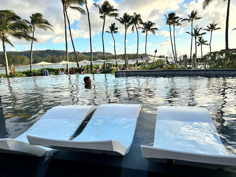 Turtle Bay Resort Pool Turtle Bay Resort Pool with lounging water chairs.