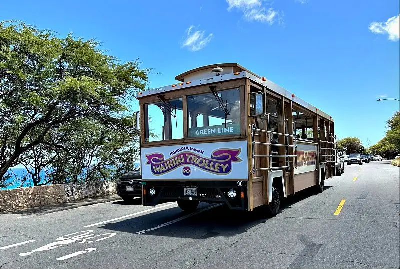Waikiki Trolley Green Line Waikiki Trolley Green Line traveling along Diamond Head Cliffs.